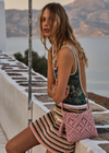 THE UPSIDE women's stripe Bohemia Crochet Mini Skirt is true to size with an encased elastic waist and striped pattern in pink, green, tan, and cream. Made for lifestyle.