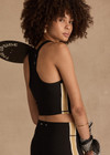 THE UPSIDE women's black Arcadia Sophie Crop Top is supportive and comfortable with a racerback longline design, internal shelf bra, and removable cups. Made for yoga & pilates.