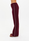 THE UPSIDE women's maroon Mendoza Jackie Flare Pant is true to size and features cream piping along side seams and zipper pockets. Made for lifestyle.