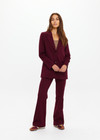 THE UPSIDE women's maroon Mendoza Boyfriend Blazer is designed as a boyfriend style single breasted blazer with cream piping along side seams, tortoiseshell buttons and front welt pockets.