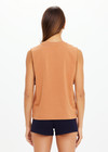 THE UPSIDE women's orange organic cotton Dawson Tank has a relaxed fit, mid length, and a printed lime varsity logo on the front chest. Made for lifestyle.