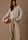 THE UPSIDE women's natural wool blend Xanthe Crew Neck Knit Sweater has a relaxed fit with cable knit and decorative blanket stitching. Made for lifestyle.