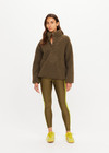 THE UPSIDE women's green recycled polyester Harlow Fleece Pullover is designed for a relaxed fit and features a quarter snap button opening and zip pockets. Made for lifestyle.