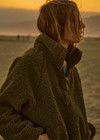 THE UPSIDE women's green recycled polyester Harlow Fleece Pullover is designed for a relaxed fit and features a quarter snap button opening and zip pockets. Made for lifestyle.