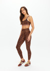 THE UPSIDE women's leopard Malawi 25inch Midi Pant offers soft & supportive fit and features a orange and navy striped drawcord in our recycled peached fabrication. Made for yoga & pilates.