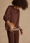 THE UPSIDE women's brown organic cotton Toluca Lisel Crew Neck Sweater offers a relaxed fit with a dropped shoulder and features a ribbed neckline and cuffs. Made for lifestyle.