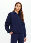 THE UPSIDE women's navy organic cotton Collared Elle Polo is a relaxed long sleeve polo featuring buttons on front. Made for everyday.