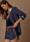 THE UPSIDE women's navy & white stripe Belize Marlin Short is a low-rise mini short, featuring a elasticated waistband with drawcord, side seam pockets in linen fabrication. Made for lifestyle.