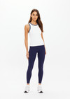 THE UPSIDE women's white performance Kirsty Rib Tank Top is designed to be fitted and features a striped navy and white rib neckband and armhole.