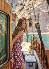 THE UPSIDE women's floral organic cotton Lahaina Maxine Wrap Mini Dress features a V neckline, wide straps and wooden bead ends on drawcord. Made for lifestyle.
