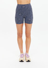 THE UPSIDE women's navy jacquard Secretos 4inch High Spin Short is high-rise and offers a soft & supportive fit in a textured floral and metallic fabrication. Made for yoga & pilates.