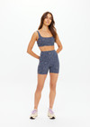 THE UPSIDE women's navy jacquard Secretos 4inch High Spin Short is high-rise and offers a soft & supportive fit in a textured floral and metallic fabrication. Made for yoga & pilates.