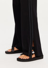 THE UPSIDE women's black Roma Pant is a high-rise fit and features an elasticated waist with drawcord, side seam pockets and an invisible zip at hem to be worn open or closed. Made for everyday.