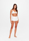 THE UPSIDE women's white Palais Rib Fox Shortie is designed to be worn under sheer garments and features a folded waistband in a soft ribbed fabrication. Made for lifestyle.