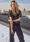 THE UPSIDE women's navy Memento Lace Sammi Tee is designed to be sheer, oversized and can be paired with the Capri Bra for coverage. Made for lifestyle.