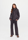 THE UPSIDE women's washed black Cosmic Carmen Moto Jacket is designed for a relaxed fit and features silver meta snap buttons, welt pockets and a soft elasticated hem. Perfect everyday outerwear piece.