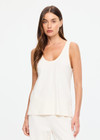 THE UPSIDE women's cream cotton Noosa Calling Tank Top is a relaxed fit in a soft brushed recycled fabrication, featuring a scoop neckline and inside bind edges. Made for lifestyle.