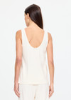 THE UPSIDE women's cream cotton Noosa Calling Tank Top is a relaxed fit in a soft brushed recycled fabrication, featuring a scoop neckline and inside bind edges. Made for lifestyle.