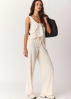 THE UPSIDE women's cream cotton Noosa Calling Tank Top is a relaxed fit in a soft brushed recycled fabrication, featuring a scoop neckline and inside bind edges. Made for lifestyle.