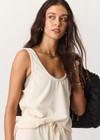 THE UPSIDE women's cream cotton Noosa Calling Tank Top is a relaxed fit in a soft brushed recycled fabrication, featuring a scoop neckline and inside bind edges. Made for lifestyle.