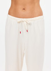 THE UPSIDE women's cream cotton Noosa Calling Track Pant is a low-rise straight leg pant with a soft elastic waistband, made from soft brushed recycled fabric. Made for lifestyle.