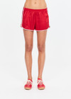 THE UPSIDE women's red 100% silk Run For Your Life Silk Short is a low-rise fit with a soft elastic waistband and cream piping along side seams. Made for lifestyle.
