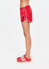 THE UPSIDE women's red 100% silk Run For Your Life Silk Short is a low-rise fit with a soft elastic waistband and cream piping along side seams. Made for lifestyle.