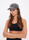 THE UPSIDE women's black Cosmic Washed Denim Soft Cap features a horseshoe logo at front and an adjustable strap at back.