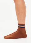 THE UPSIDE women's walnut brown Avalon Grip Sock features an anti-slip sole with midi ankle height, designed with navy and cream stripes, grip and logo. Made for yoga & pilates.