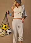 THE UPSIDE women's cream Courtship Henri Collared Top is made in moisture wicking, rib performance fabric and features a ribbed collar and buttons on front neckline. Made for tennis, gold & pickleball.