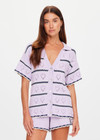 THE UPSIDE women's lilac organic cotton Amara Amayah Knit Shirt is a relaxed fit and features an open knit heart design and pearlised shell buttons. Made for tennis, golf & pickleball.