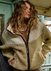 THE UPSIDE women's natural Harlow Fleece Zip Through is designed for a relaxed fit in a warm fleece fabrication and features an elastic waist and cuffs and zip pockets. Made for lifestyle.