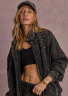 THE UPSIDE women's washed black Cosmic Carmen Moto Jacket is designed for a relaxed fit and features silver meta snap buttons, welt pockets and a soft elasticated hem. Perfect everyday outerwear piece.