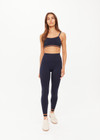 THE UPSIDE women's navy Form Seamless Kelsey Bra is firm and supportive and features a double layer with contrast tan underlayer and soft ribbed underbust. Made for yoga & pilates.