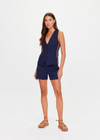 THE UPSIDE women's navy Toledo Greer Vest Top features tan knitted tape down sides, an adjustable waistbelt with buckle and tortoiseshell buttons. Made for lifestyle.