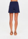 THE UPSIDE women's navy Toledo Leon Bermuda Short is a longerline tailored short featuring tan knitted tape down sides, flat waistband with belt loops and side pockets. Made for lifestyle.