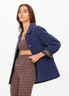 THE UPSIDE women's navy Levi Reversible Quilted Jacket is designed for a relaxed fit and features welt pockets, magnectic snap closure and a water resistant coating on black quilting. The perfect outerwear piece.