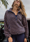 THE UPSIDE women's navy & camel Castilla Harlow Pullover is a relaxed pull over style fleece with raglan sleeves in our castilla "TU" design and features zip pockets, crafted from a recycled sherpa fabrication. Perfect for cooler weather.