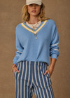 THE UPSIDE women's blue organic cotton Rever Josette V Neck Sweater is designed for a relaxed fit and features a striped V neckline in yellow and blue and contrast starts on sleeves. Made for everyday.