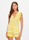 THE UPSIDE women's yellow organic cotton Goldie Watson Crochet Vest is designed for a regular fit and features a hand crocheted flower design and pearl shell buttons. Made for lifestyle.