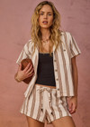 THE UPSIDE women's mocha stripe organic cotton Baja Katia Collared Shirt offers a relaxed fit and features a collar, patch pockets and wooden coconut buttons. Made for lifestyle.