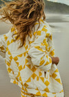 THE UPSIDE women's yellow organic cotton Etoile Carmen Quilted Jacket fits oversized and features front pockets, an elasticated hem and zip through opening. Made for lifestyle.