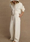 THE UPSIDE women's cream organic cotton terry Arkana Estelle Pant is designed for a relaxed fit with a barrel shaped leg and features an elasticated waistband and side pockets. Made for lifestyle.