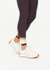 THE UPSIDE women's grey recycled soft peached Kefi 25inch Legging is designed for a mid-rise fit, with an elastic drawcord and aglet ends, crafted with a panelled rainbow feature at the hem. Made for yoga & pilates.