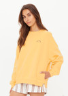 THE UPSIDE women's yellow organic cotton Paradise Coolum Crew is designed for an oversized fit, with discreet side seem pockets and ribbed neckline, cuffs and hem. Made for everyday wear.