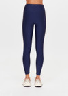 THE UPSIDE women's navy eco tech Toscan 25inch High Legging features a high-rise, breathable design with contrast mocha and cream binds along side seam. Made for yoga & pilates.