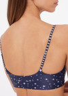 THE UPSIDE women's blue Bellaire Ballet Sports Bra features a cream star print and offers soft support and low coverage, designed with adjustable straps and a supersoft recycled fabrication. Made for yoga & pilates.