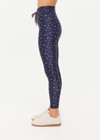 THE UPSIDE women's blue Bellaire 25Inch Legging features a cream star print with a mid rise design, tan striped drawcord and a supersoft recycled fabrication. Made for yoga & pilates.