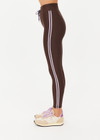 THE UPSIDE women's brown eco tech Oxford 25Inch Legging offers a mid rise with lilac coloured binds down side seams and an elastic drawcord through waist. Made for high impact.