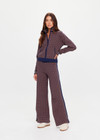THE UPSIDE women's brown organic cotton Lumiere Margot Knit Jacket is a knitted long sleeve with a geometric star pattern, front pockets and contrast stripes around the sleeves. Made for lifestyle.